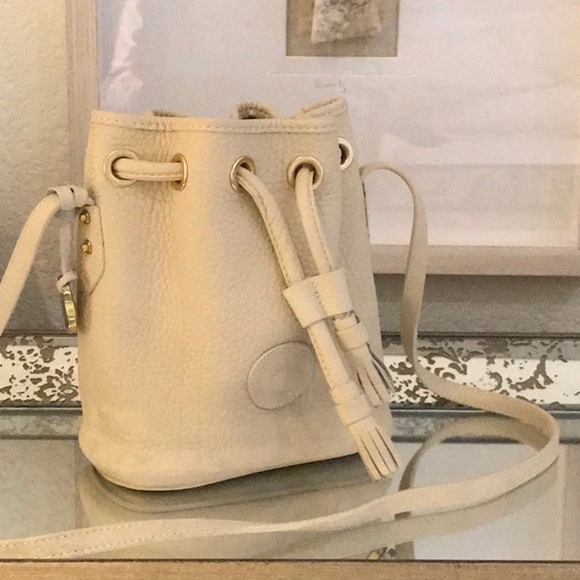 Dooney & Bourke Handbags - Dooney  cream leather small drawstring bag
